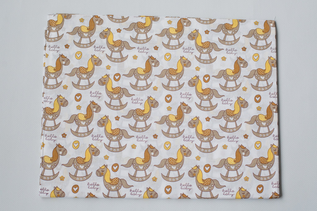 Regular Cotton Fabric - Zhelto Korychnevye Rocking Horses On White