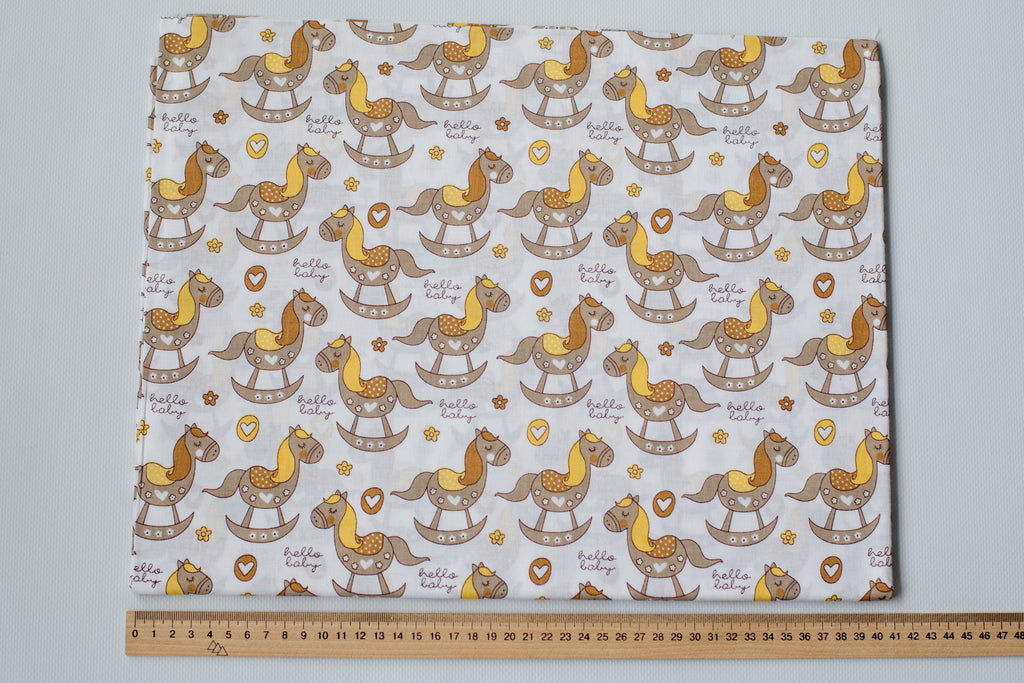 Regular Cotton Fabric - Zhelto Korychnevye Rocking Horses On White