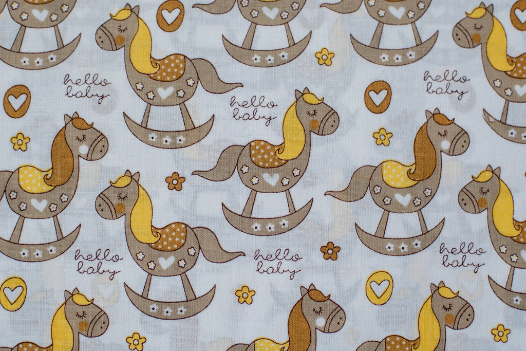 Regular Cotton Fabric - Zhelto Korychnevye Rocking Horses On White