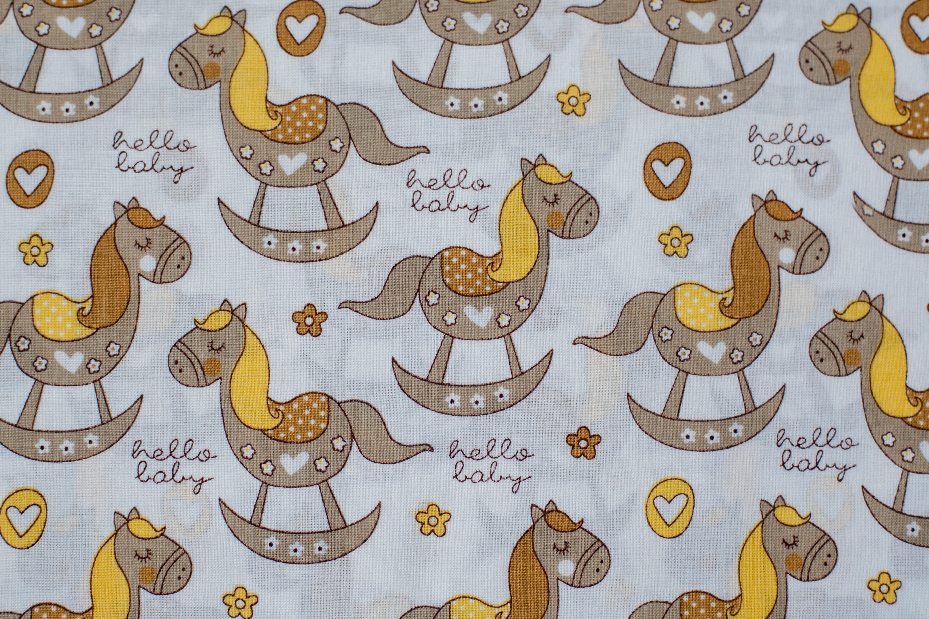Regular Cotton Fabric - Zhelto Korychnevye Rocking Horses On White