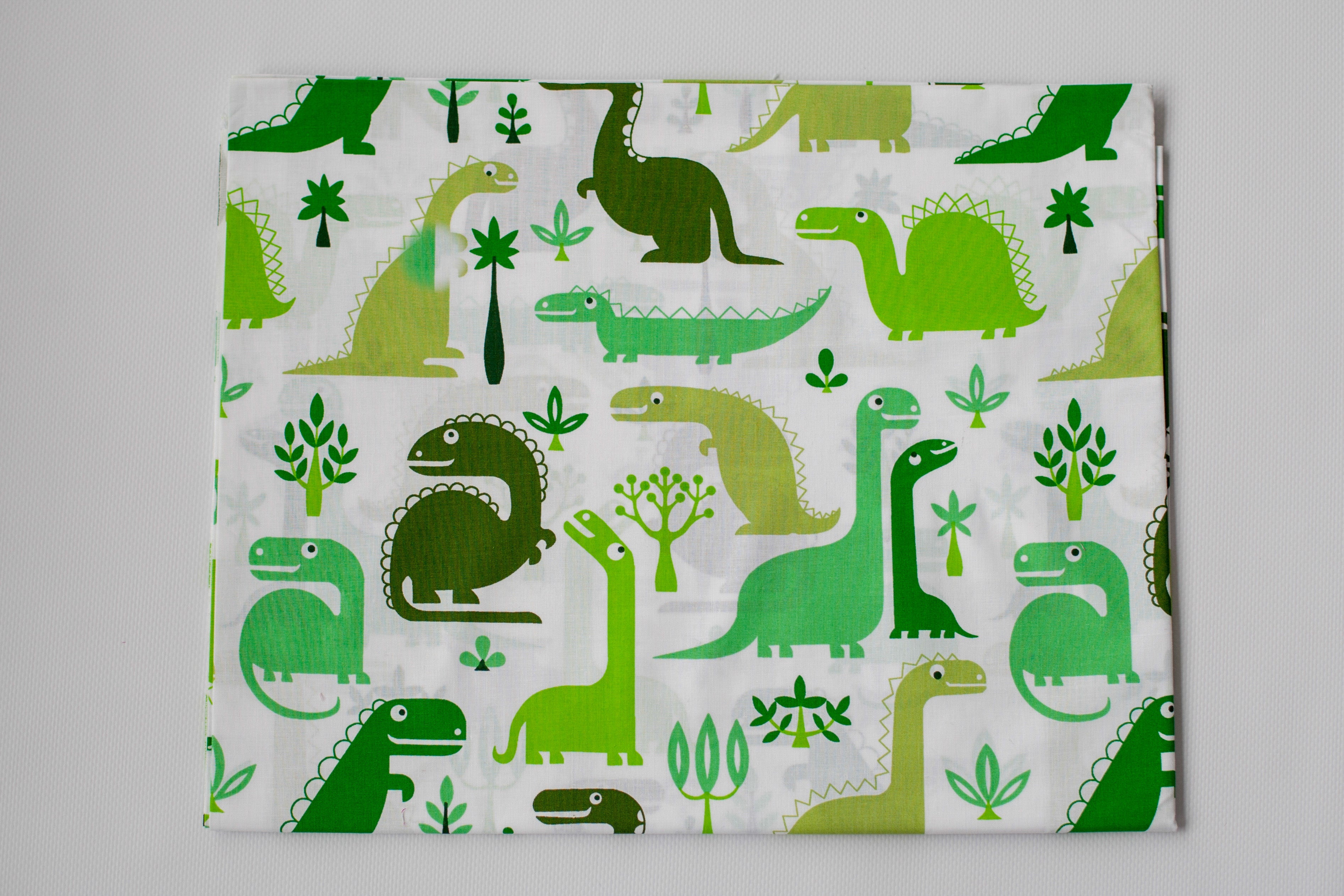 Regular Cotton Fabric - Green Dinosaurs On White