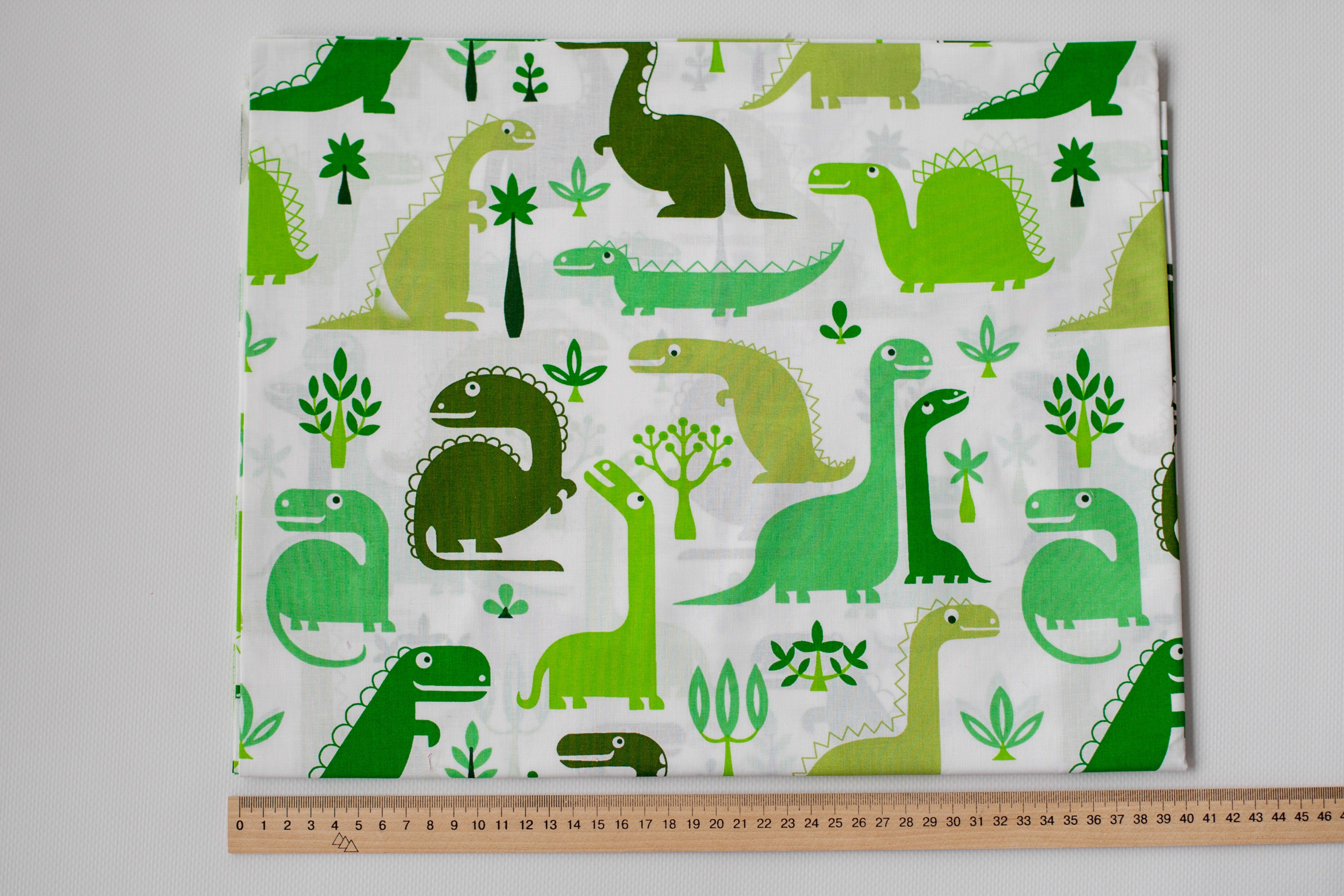 Regular Cotton Fabric - Green Dinosaurs On White