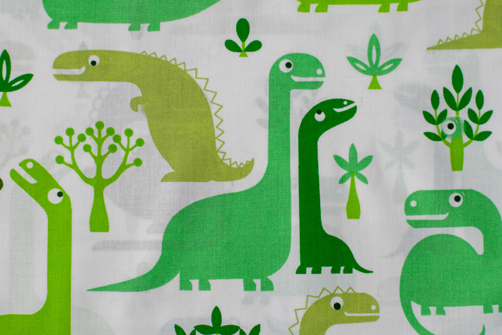 Regular Cotton Fabric - Green Dinosaurs On White