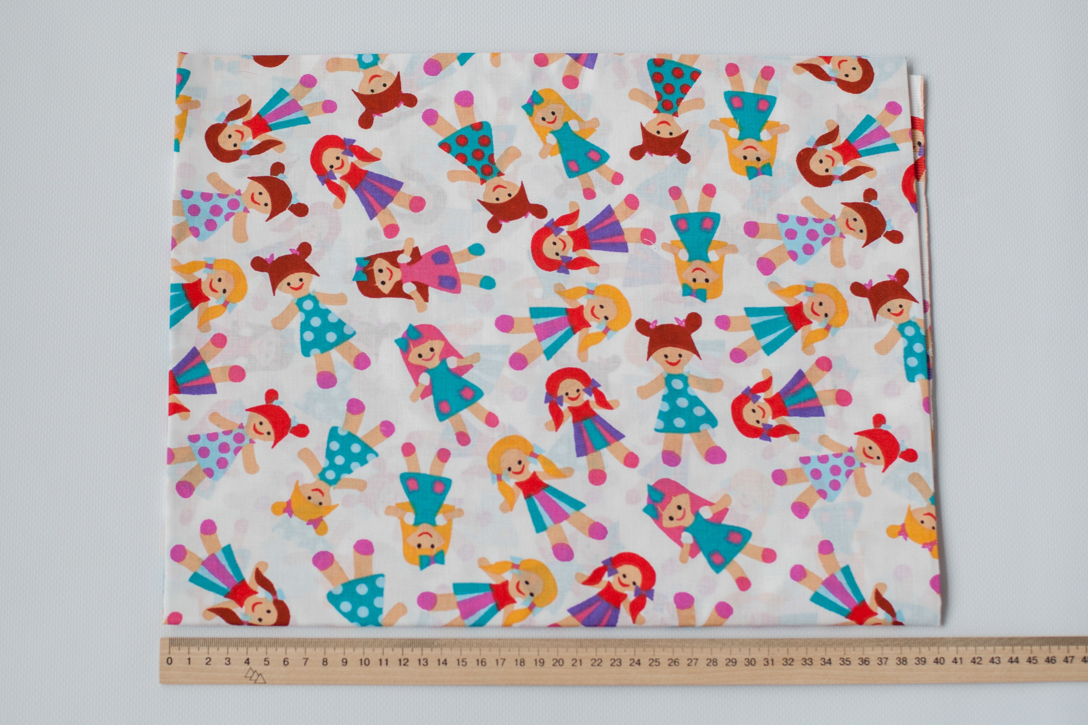 Regular Cotton Fabric - Multicolor Dolls On White