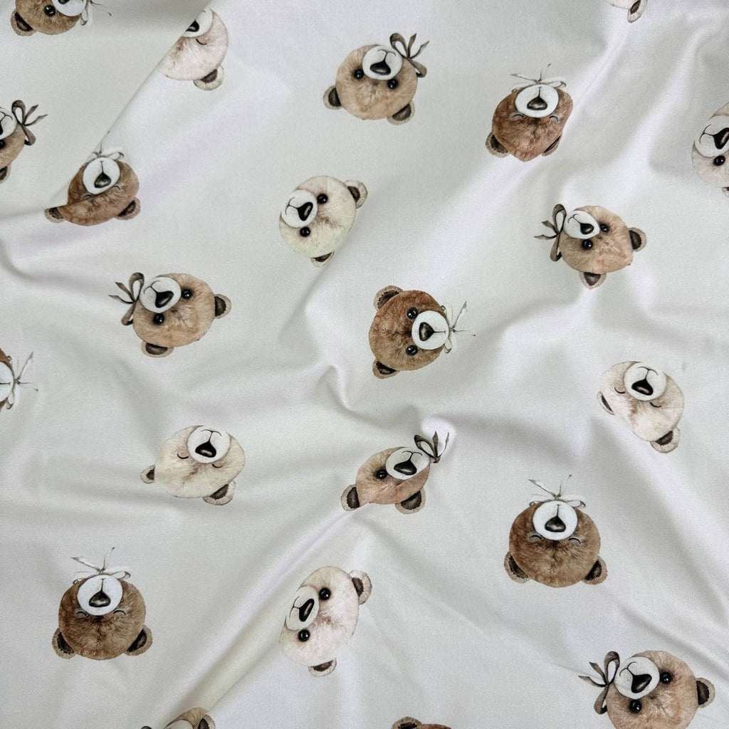 Teddy bears on a light beige background