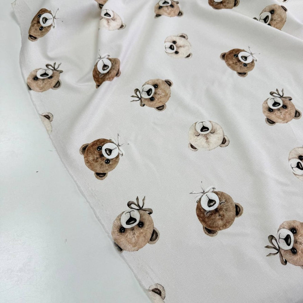 Teddy bears on a light beige background