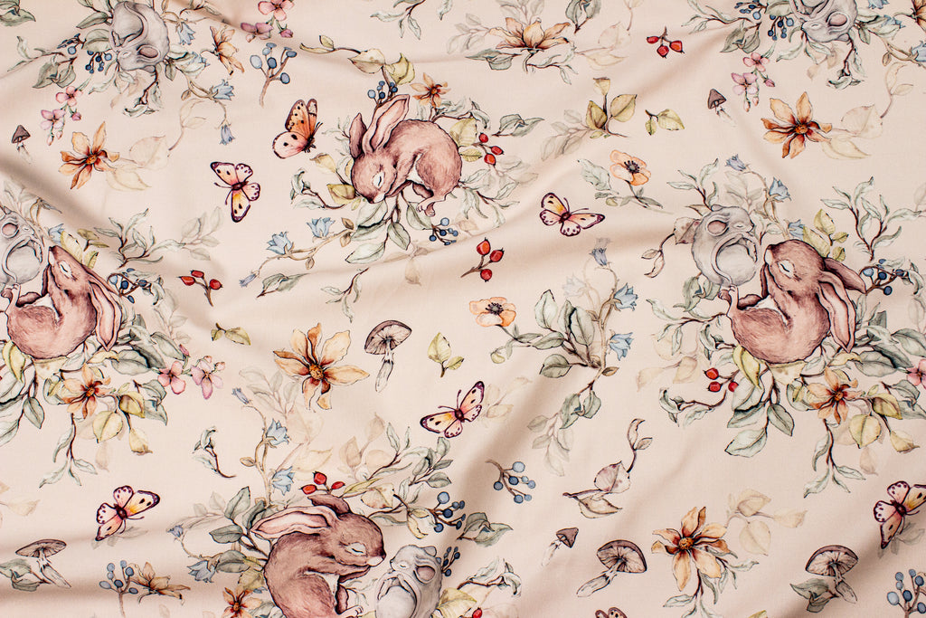 Bunny and mouse sleeping on a beige background