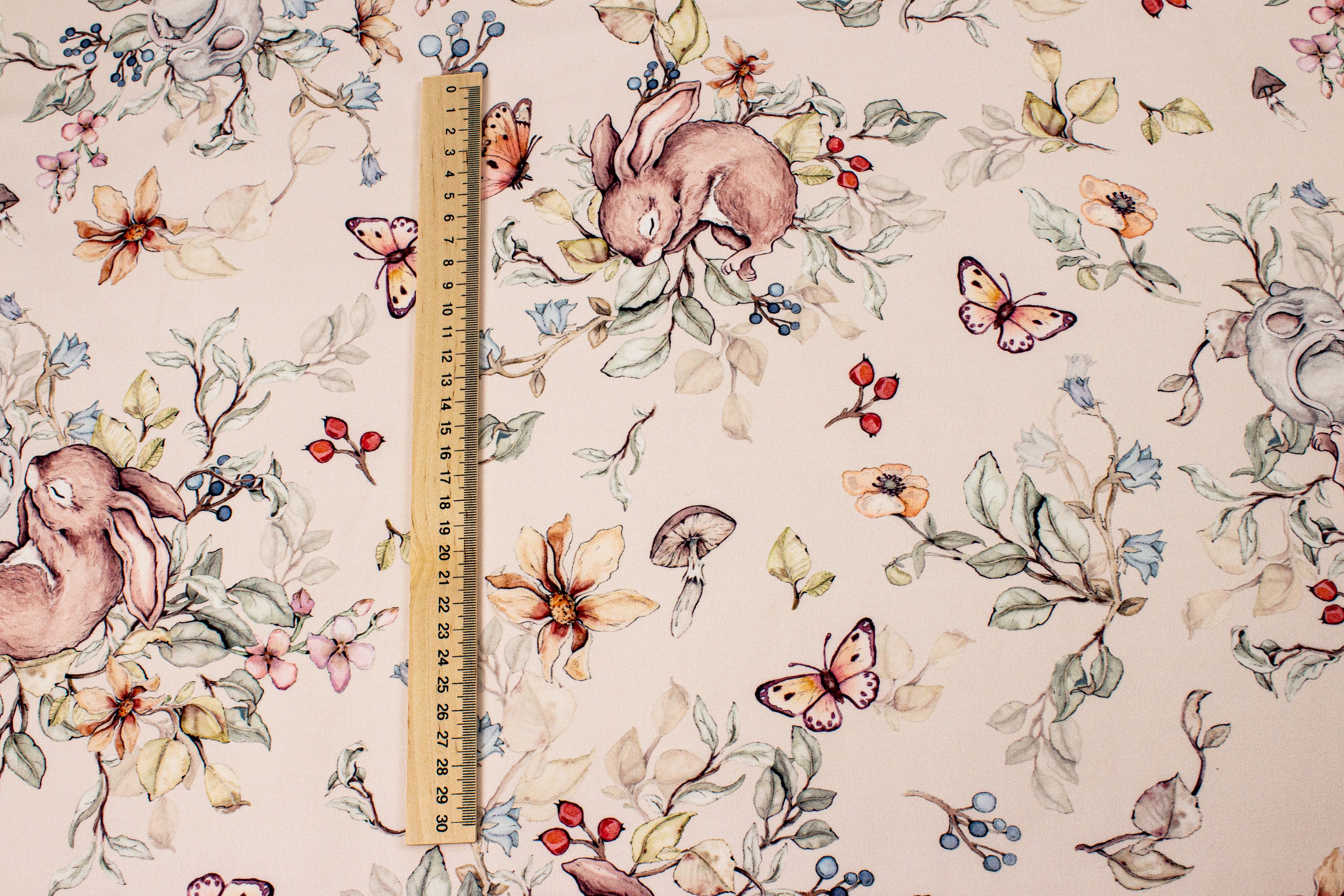 Bunny and mouse sleeping on a beige background