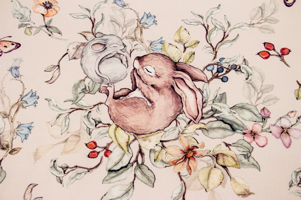 Bunny and mouse sleeping on a beige background