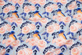 Roses with a bird on blue