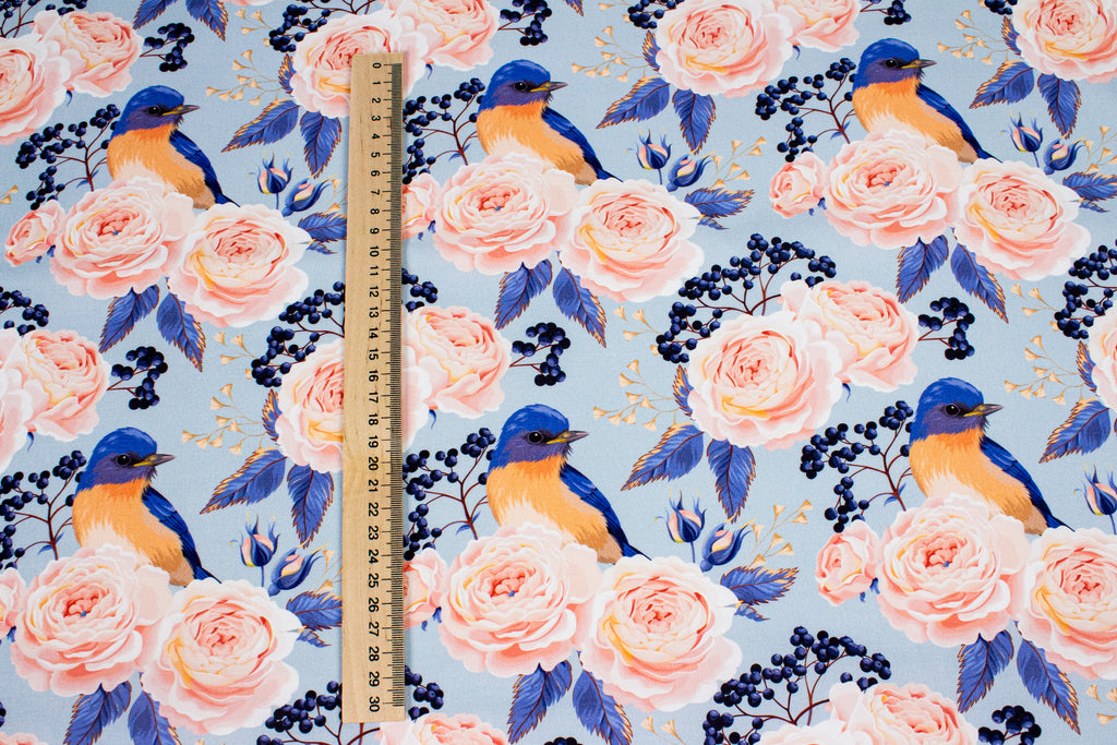 Roses with a bird on blue