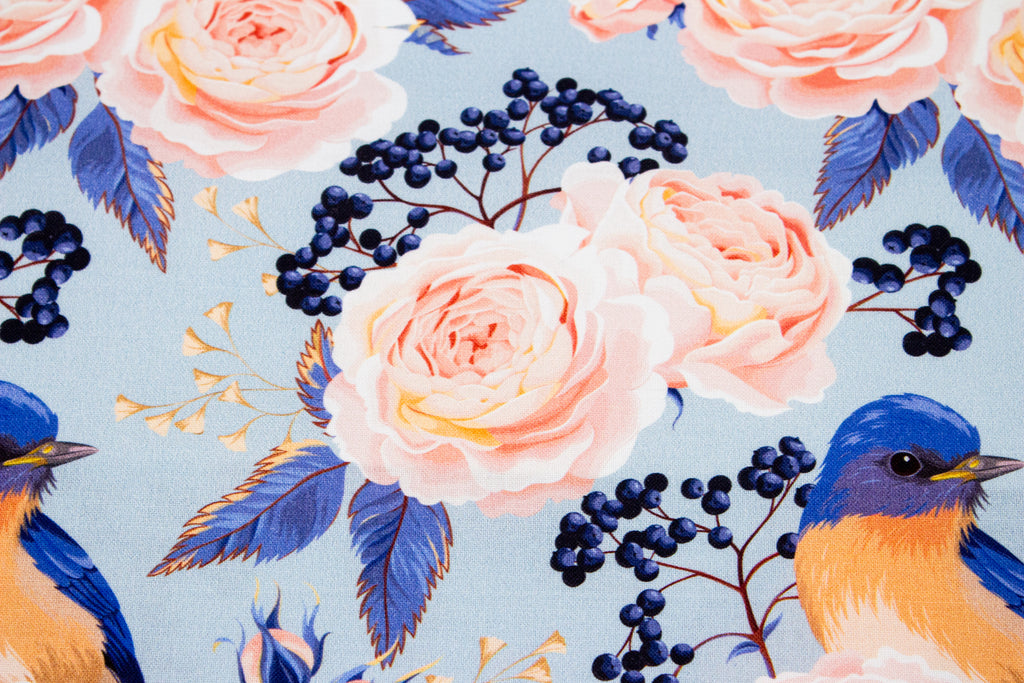 Roses with a bird on blue