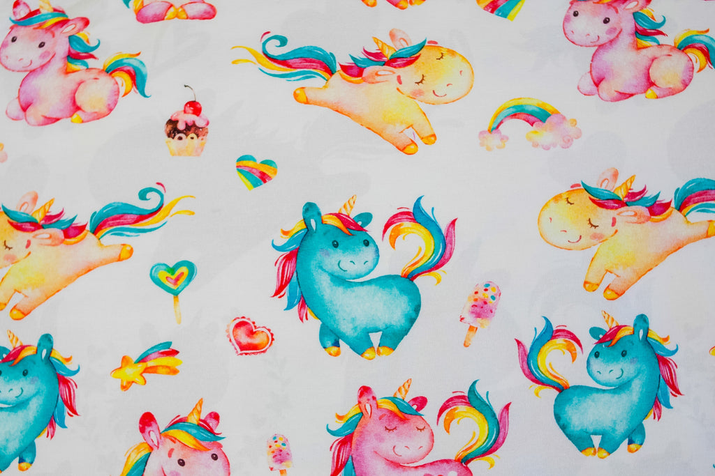Twin unicorns on white