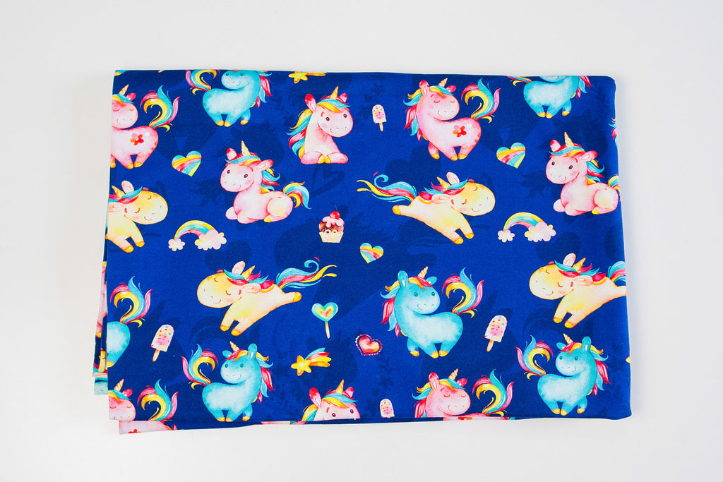 Twin unicorns on blue