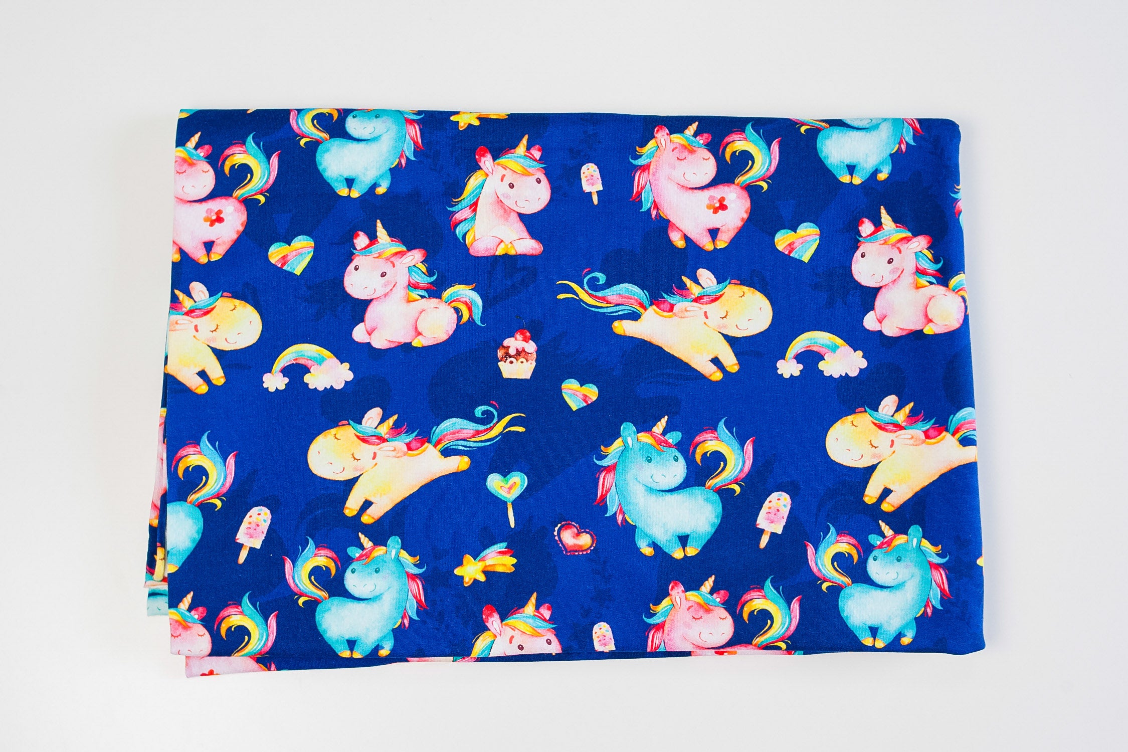 Twin unicorns on blue