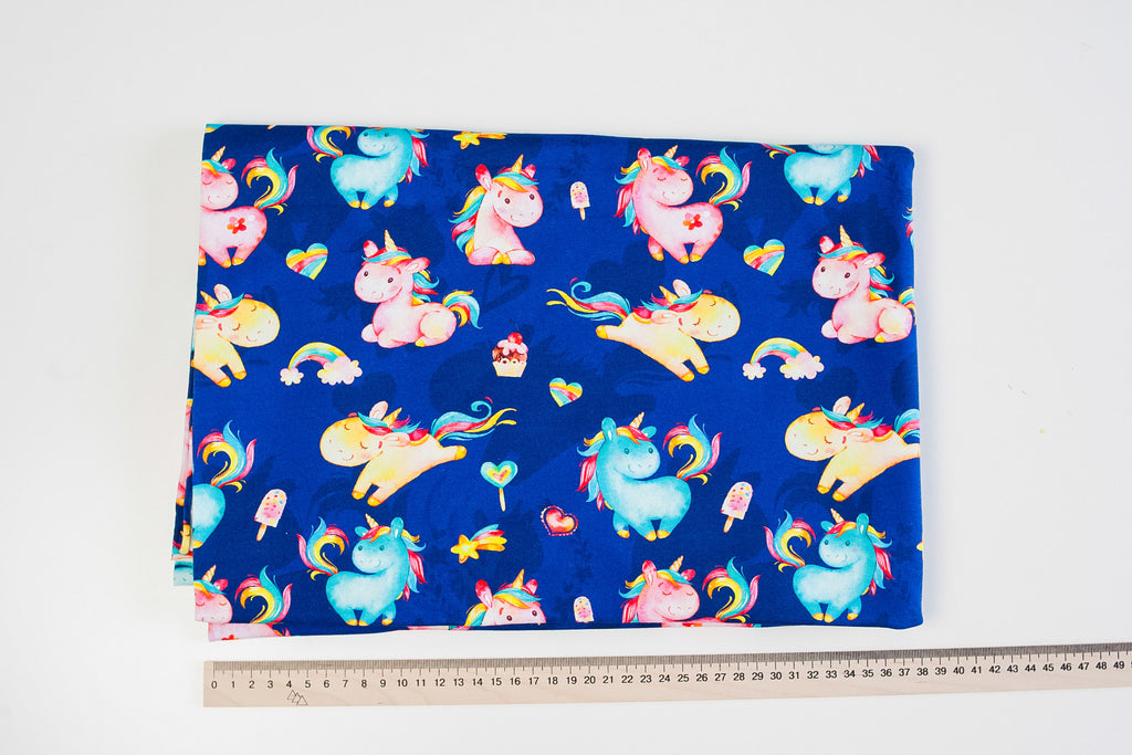 Twin unicorns on blue