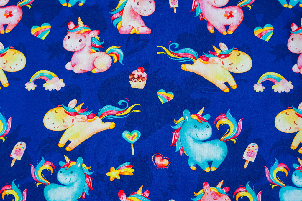 Twin unicorns on blue